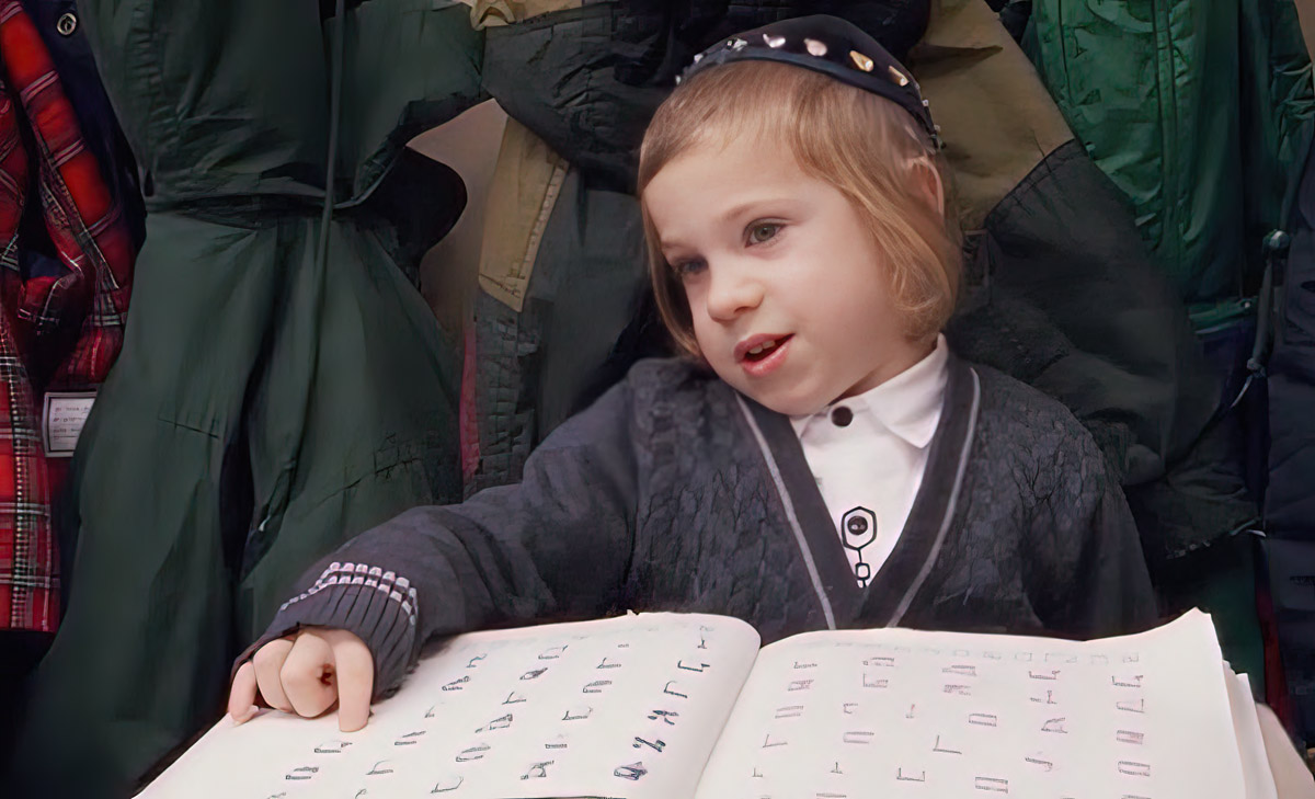 IMAGE 2 Young Hasidic boy learning the aleph-beit. Photo by Oren Rudavsky.