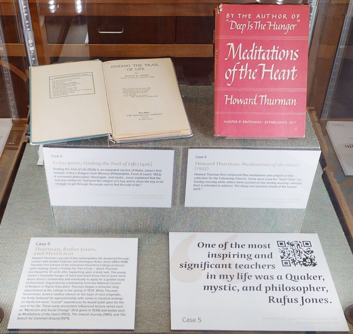An example of the integration of QR codes into display cases. Case 5 includes a case label describing Thurman’s relationship with Quaker historian and theologian Rufus Jones, two related books with accompanying labels, and a label with a quote from Thurman and a QR code linking to the pertinent audio excerpt. 