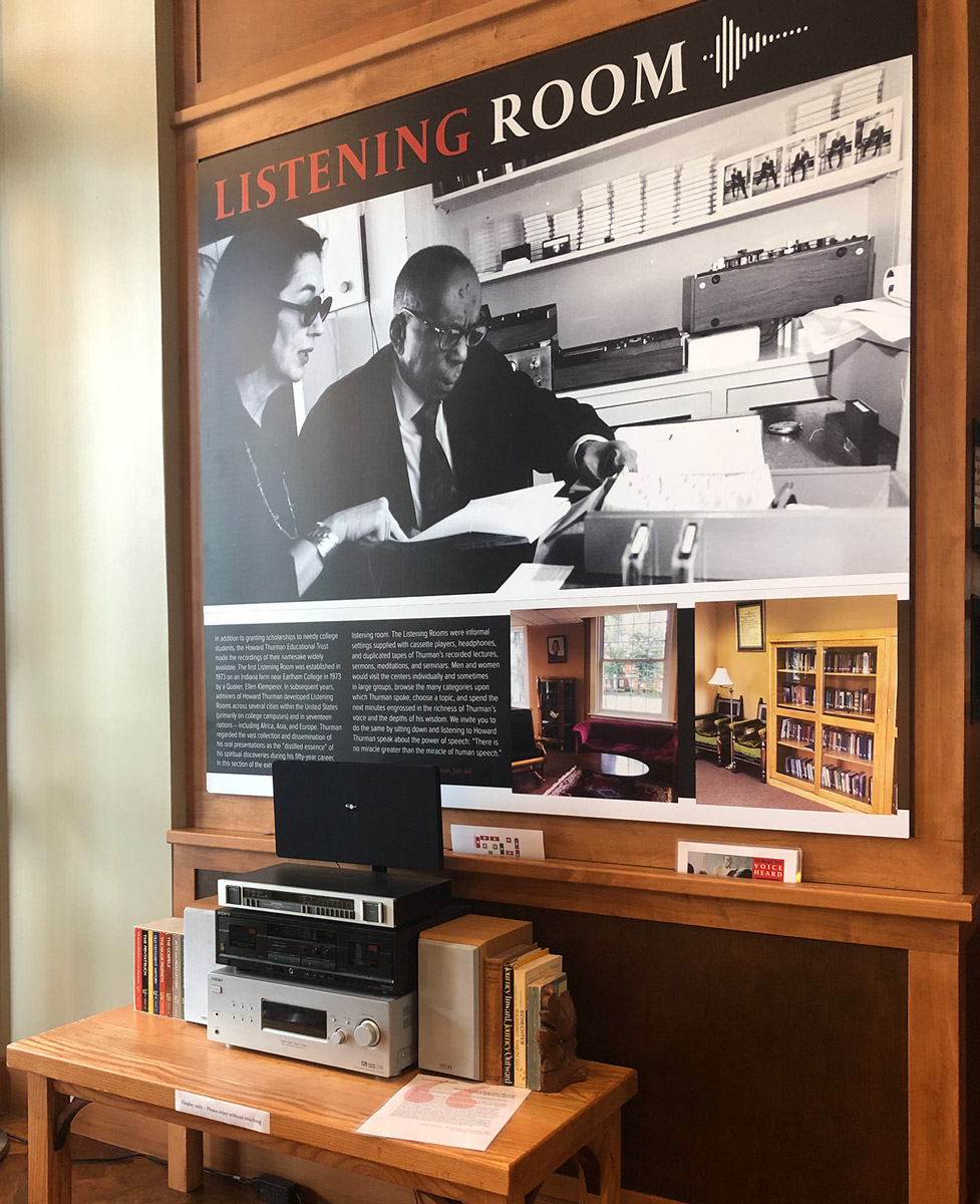The interactive display at the entrance of the gallery was meant to replicate an atmosphere rather than a strict reproduction of the experience of listening to Howard Thurman on audio tape in a Listening Room. It also featured a large graphic of Thurman reviewing tapes in his San Francisco office and a description of the original Listening Rooms across the country. 